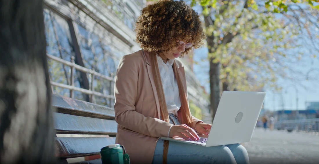A student working under a tree.