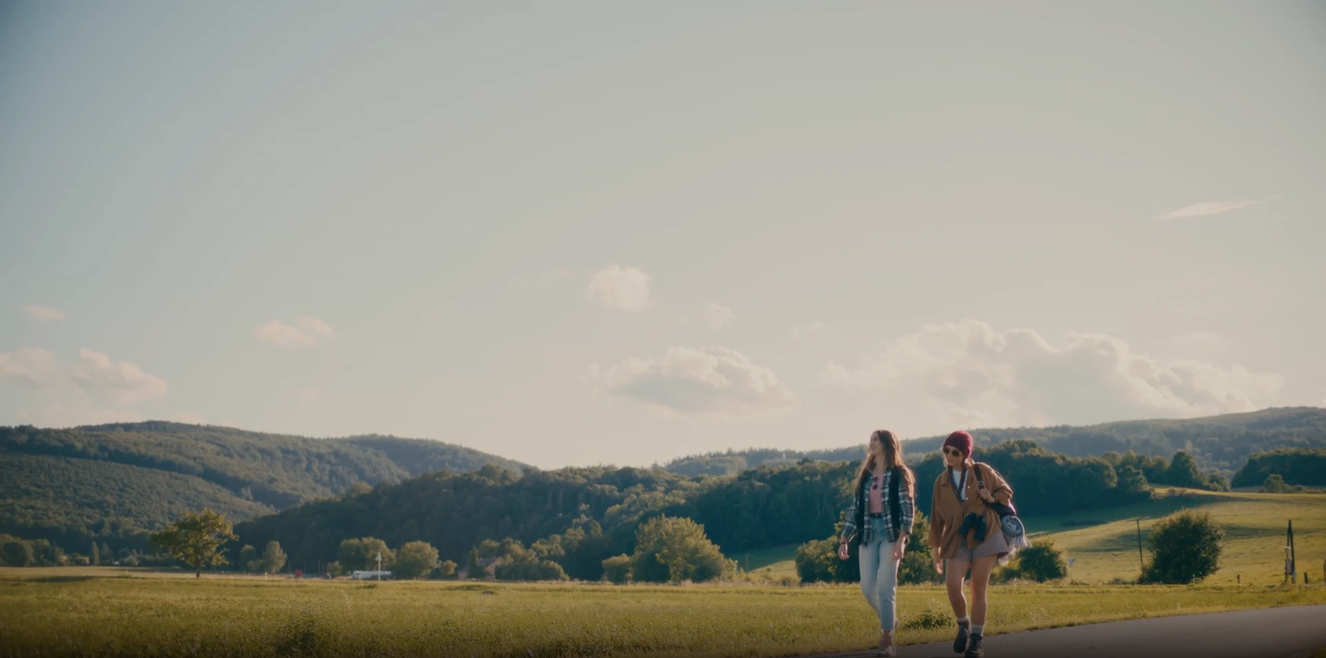 Two students walking a country road on their exchange year.