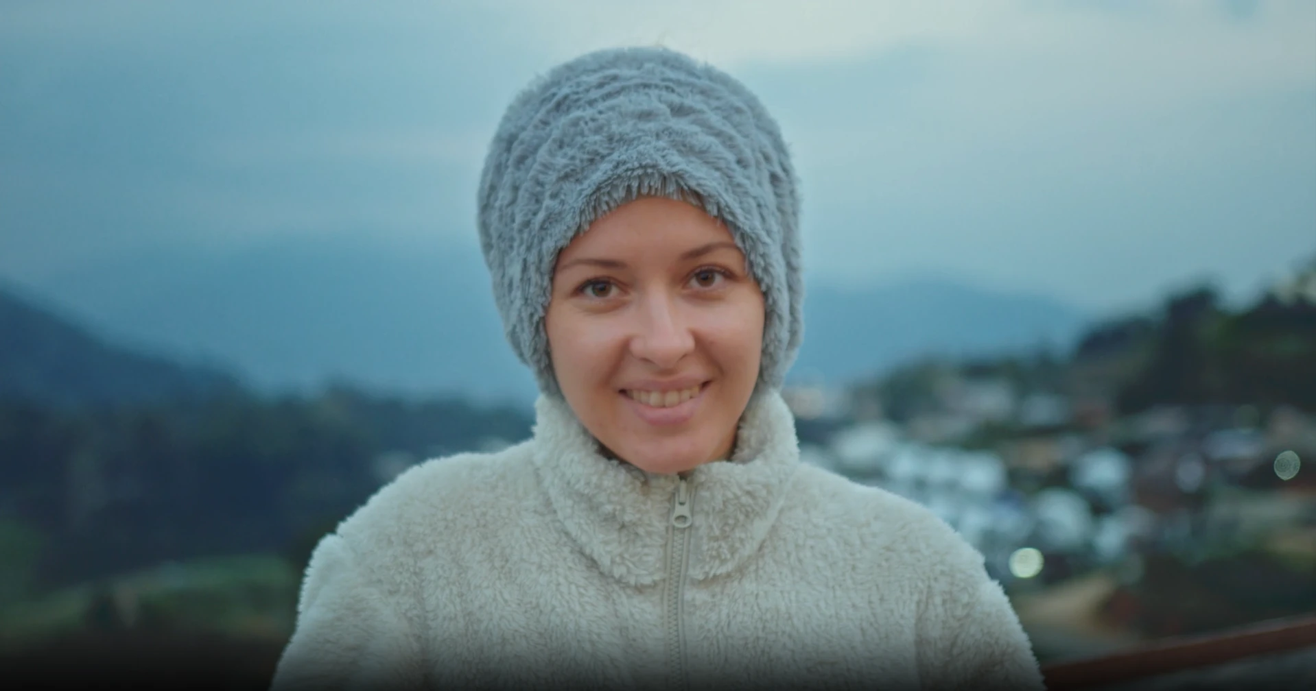 An exchange student in the mountains at dusk.